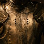 Close-up of intricately designed medieval armor as a metaphor for protection