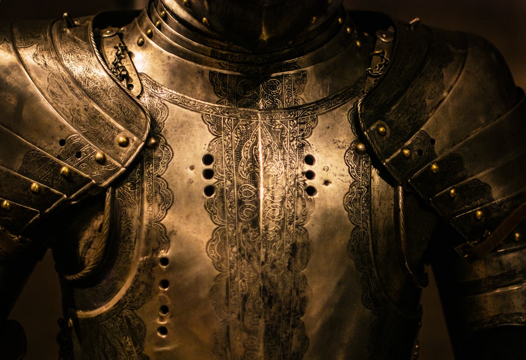 Close-up of intricately designed medieval armor as a metaphor for protection